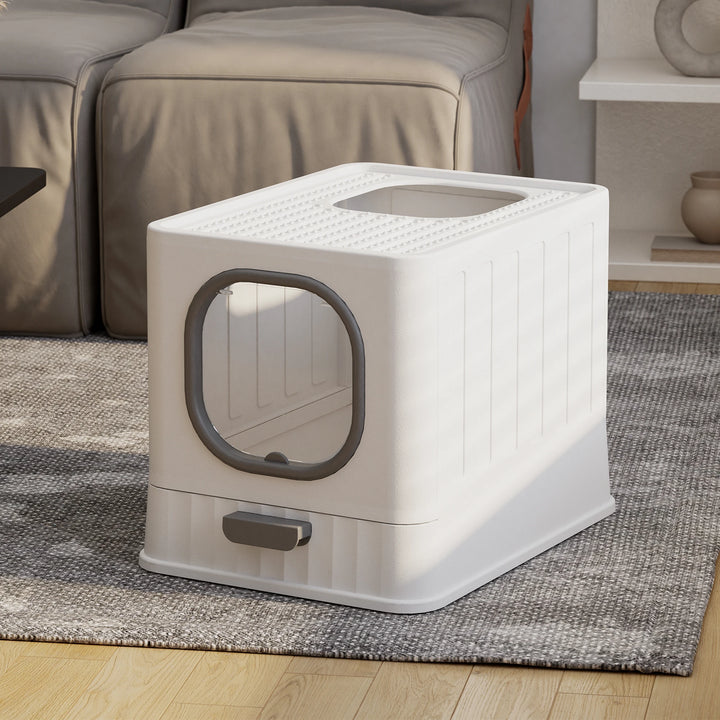 Designer closed cat litter box with top exit